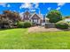 Expansive backyard with a patio area, perfect for outdoor entertaining and relaxation amidst lush greenery at 132 Broadbill Dr, Mooresville, NC 28117