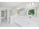 Elegant bathroom showcasing double sinks, a glass shower, and a large mirror, offering a spa-like experience at 132 Broadbill Dr, Mooresville, NC 28117
