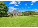 Beautiful two-story brick home with manicured lawn and landscaping, offering classic charm and curb appeal at 132 Broadbill Dr, Mooresville, NC 28117