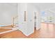 Bright foyer featuring hardwood floors, a staircase, and an arched window providing natural light at 132 Broadbill Dr, Mooresville, NC 28117