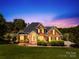 Charming brick home with manicured lawn, mature landscaping, and inviting entrance at 132 Broadbill Dr, Mooresville, NC 28117