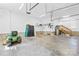 Spacious garage area, featuring ample storage and well-lit work areas, and a door to access inside the house at 132 Broadbill Dr, Mooresville, NC 28117