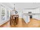Bright kitchen with white cabinets, stainless steel appliances, and a cozy breakfast nook, perfect for modern living at 132 Broadbill Dr, Mooresville, NC 28117