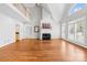 Bright living room with hardwood floors, fireplace, and natural light, perfect for relaxation and entertaining at 132 Broadbill Dr, Mooresville, NC 28117