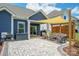 Inviting outdoor patio area features comfortable seating, a pergola, and a charming brick paved terrace at 13339 Mcguffy Dr, Huntersville, NC 28078