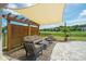 Relaxing backyard patio featuring comfortable seating, a stylish pergola, and a lush green lawn at 13339 Mcguffy Dr, Huntersville, NC 28078