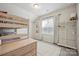 Bright bedroom featuring a bunk bed, plush carpet, a window with blinds, and a charming storage shelf at 13339 Mcguffy Dr, Huntersville, NC 28078