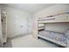 Bedroom featuring a bunk bed, plush carpet, white double door closet, and a charming storage shelf at 13339 Mcguffy Dr, Huntersville, NC 28078