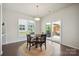 Bright dining area with large window and sliding glass doors to the backyard at 13339 Mcguffy Dr, Huntersville, NC 28078