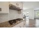 Modern kitchen featuring granite counters, subway tile backsplash, and stainless steel appliances at 13339 Mcguffy Dr, Huntersville, NC 28078