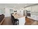 Well-appointed kitchen with granite countertops, stainless steel appliances, and adjacent living area at 13339 Mcguffy Dr, Huntersville, NC 28078