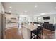 Open-concept kitchen featuring granite countertops, stainless steel appliances, and a large island with seating at 13339 Mcguffy Dr, Huntersville, NC 28078