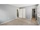 Bedroom featuring carpet flooring, neutral paint, with two entrances at 1510 Sansberry Rd, Charlotte, NC 28262