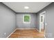 Cozy bedroom with hardwood floors, neutral paint, and natural light at 1510 Sansberry Rd, Charlotte, NC 28262
