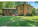 Charming brick home featuring a well-manicured lawn and classic architectural details at 1510 Sansberry Rd, Charlotte, NC 28262