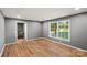 Living room featuring hardwood floors, a large window and neutral paint at 1510 Sansberry Rd, Charlotte, NC 28262
