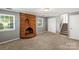 Living room featuring a brick fireplace, carpet flooring and neutral paint at 1510 Sansberry Rd, Charlotte, NC 28262