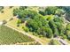 Aerial view of a house on a large lot with trees and green fields at 155 Mcallister Rd, Statesville, NC 28625