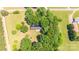 Aerial view showing the house on a lush green property surrounded by trees at 155 Mcallister Rd, Statesville, NC 28625