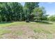 Expansive backyard featuring lush green grass and mature shade trees at 155 Mcallister Rd, Statesville, NC 28625