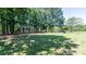 Expansive backyard featuring lush green grass and mature shade trees at 155 Mcallister Rd, Statesville, NC 28625