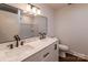Bright bathroom featuring a double sink vanity, white marble countertops, and modern fixtures at 155 Mcallister Rd, Statesville, NC 28625