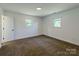 Well-lit bedroom with neutral carpet, white walls, and windows offering natural light at 155 Mcallister Rd, Statesville, NC 28625