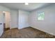 Bedroom featuring neutral carpet, a large window, and closet at 155 Mcallister Rd, Statesville, NC 28625