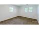 Bedroom with carpet, white walls, and two windows at 155 Mcallister Rd, Statesville, NC 28625