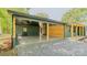 Spacious carport featuring wood columns, brick accents, and a wooden accent wall providing ample covered parking at 155 Mcallister Rd, Statesville, NC 28625