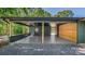 Spacious carport featuring wood columns, brick accents, and a wooden accent wall providing ample covered parking at 155 Mcallister Rd, Statesville, NC 28625