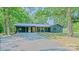 Charming, newly renovated one-story brick home featuring a metal roof and covered carport at 155 Mcallister Rd, Statesville, NC 28625
