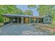 Charming, newly renovated one-story brick home featuring a metal roof and covered carport at 155 Mcallister Rd, Statesville, NC 28625