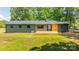 Backyard home view showcasing a metal roof and inviting wooden deck at 155 Mcallister Rd, Statesville, NC 28625