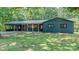 Charming, newly renovated one-story brick home featuring a metal roof and covered carport in a wooded setting at 155 Mcallister Rd, Statesville, NC 28625