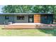 The metal roof and wooden deck highlight the home's modern outdoor space at 155 Mcallister Rd, Statesville, NC 28625