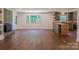 Spacious living room featuring a brick fireplace and a modern kitchen area with wood counters at 155 Mcallister Rd, Statesville, NC 28625