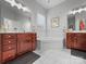 Spacious bathroom with dual vanities, corner tub, tile floor, and plenty of natural light at 163 Shoreline Pkwy, Tega Cay, SC 29708