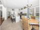 Bright kitchen features a large island, stainless steel appliances, and an adjacent breakfast nook at 163 Shoreline Pkwy, Tega Cay, SC 29708