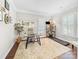 Bright home office with neutral decor, built-in shelving, and a comfortable workspace at 163 Shoreline Pkwy, Tega Cay, SC 29708