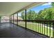 Covered back porch offers a great view of the green front yard and surrounding lush trees at 1687 Sierra Rd, York, SC 29745