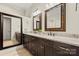 Elegant bathroom with granite counters, double sinks, dark cabinetry, and modern mirrors for a spa-like experience at 1687 Sierra Rd, York, SC 29745