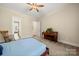 Comfortable bedroom featuring natural light, ceiling fan, and access to en-suite bathroom at 1687 Sierra Rd, York, SC 29745