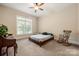Cozy bedroom with a ceiling fan and natural light from a large window at 1687 Sierra Rd, York, SC 29745