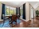Cozy dining room features a picturesque view through a large window and a bright, decorative rug at 1687 Sierra Rd, York, SC 29745
