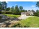 Exterior view of a home with a separate guest house, showcasing the large lot, and ample parking at 1687 Sierra Rd, York, SC 29745