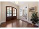 Elegant foyer featuring hardwood floors, double doors, and a view into a bright, inviting office space at 1687 Sierra Rd, York, SC 29745