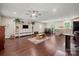 Open-concept living room boasts hardwood floors and built-in shelving at 1687 Sierra Rd, York, SC 29745