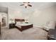 Neutral bedroom features a tray ceiling, carpeting, and a comfortable sitting area with lots of natural light at 1687 Sierra Rd, York, SC 29745