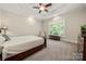 Relaxing bedroom boasts plush carpeting, a tray ceiling, and a large window with views of the outdoors at 1687 Sierra Rd, York, SC 29745
